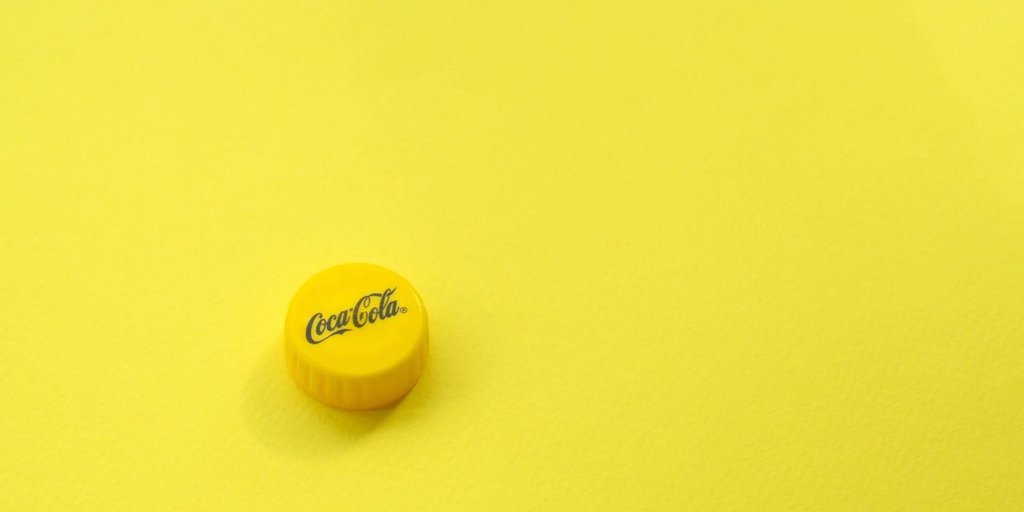 The Fascinating Reason Behind Coke Bottles Sporting a Yellow Cap